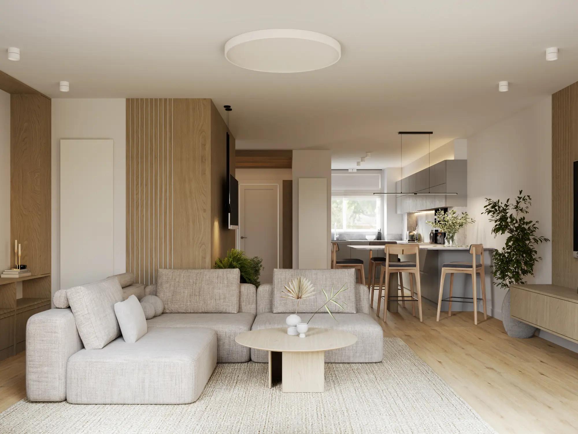 Warm Scandinavian open-plan living room and kitchen with light wood finishes, soft beige sofa, and minimalist decor.